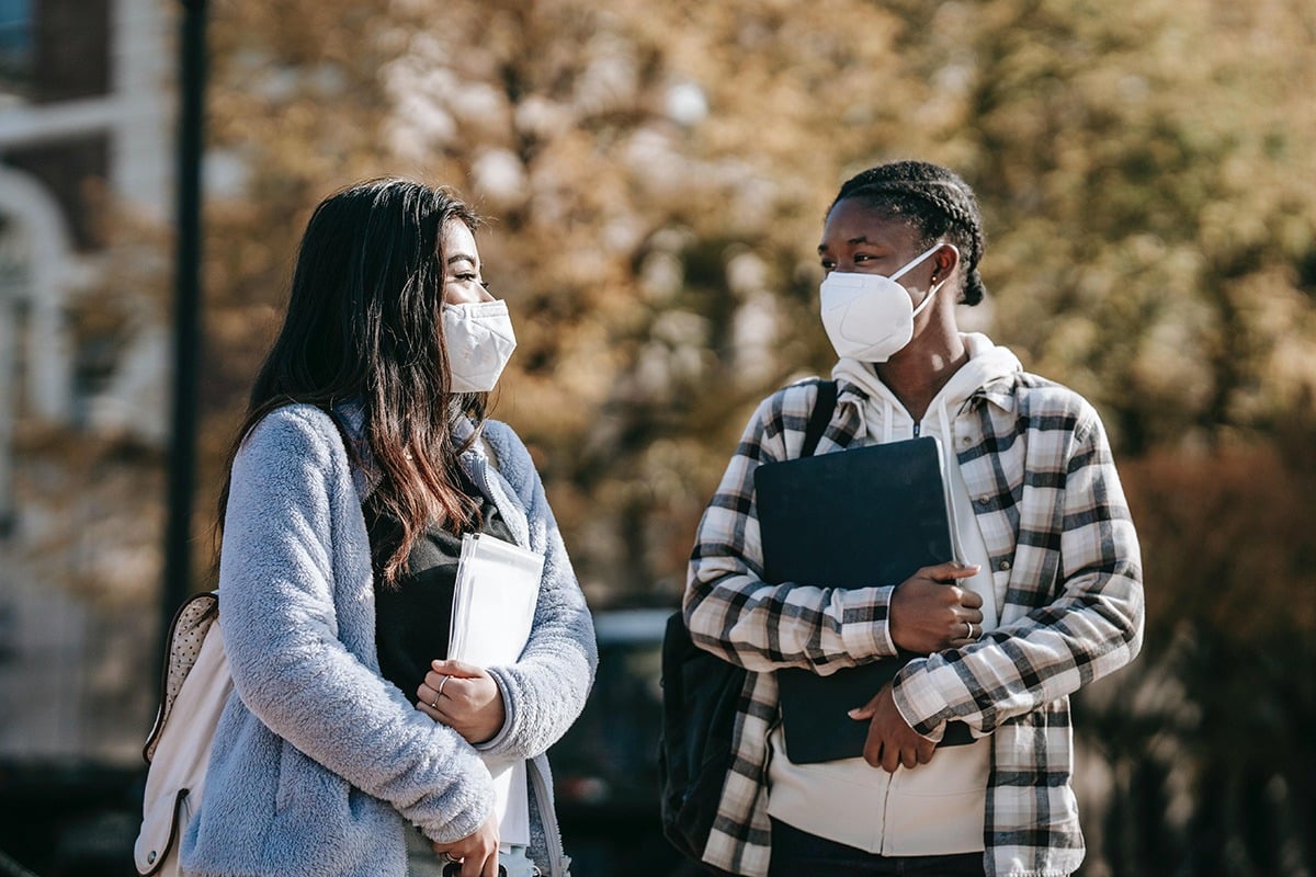 Two students attending Barnard College, after BRC helped secure COVID help for the college.