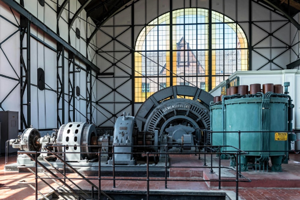 Large heavy machinery inside a large warehouse.